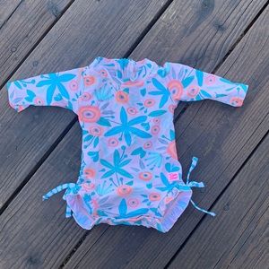 Ruffle Butts full body swimsuit